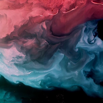 An abstract image of the colors red and blue being swirled together as if they are paint